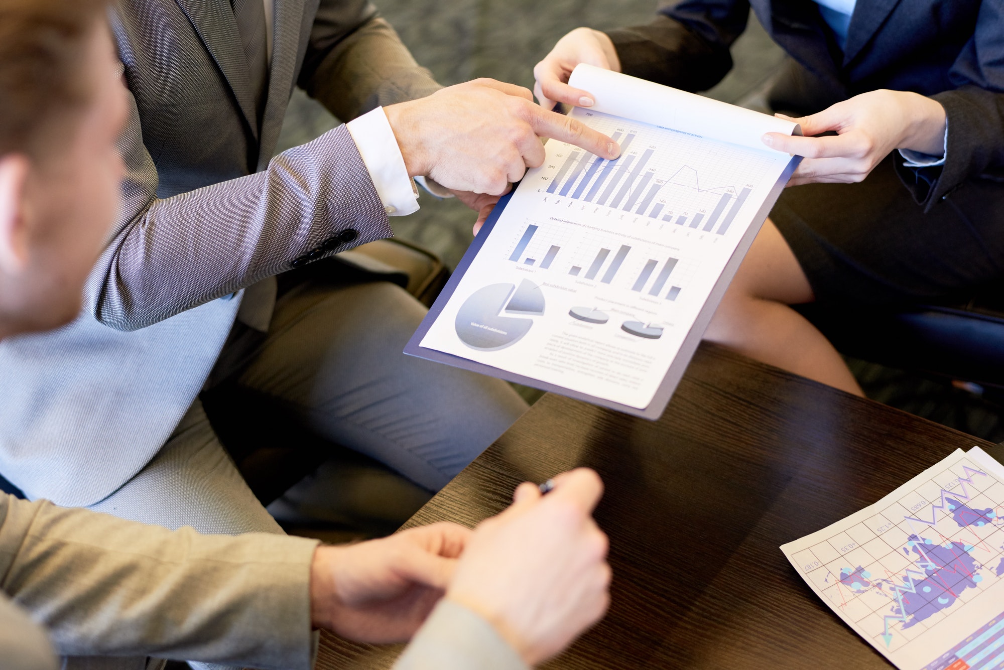 Business team reviewing financial reports together in a meeting